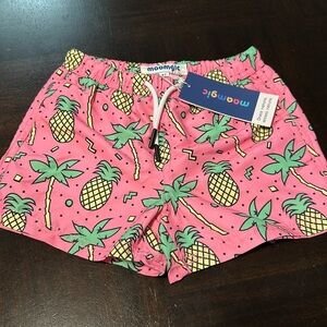 Brand new with tags Maamgic pineapple swim trunks. Size 4t